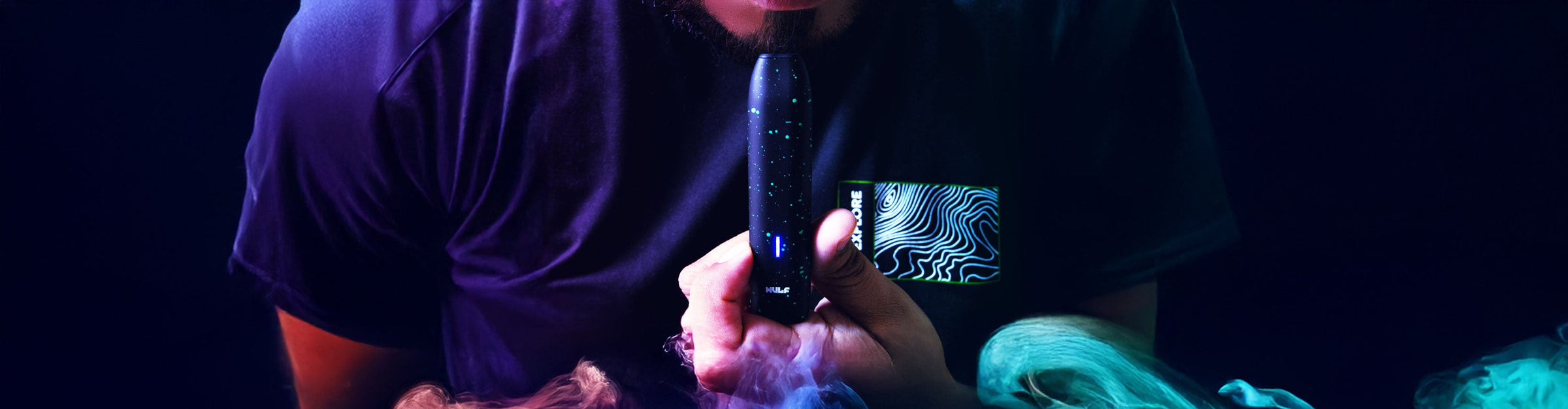Dry Herb Vaporizers Collection Image with LX Slim in man's hand and colorful smoke nearby